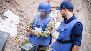 Captain Flores holds wires during a practical training session for explosive ordnance disposal