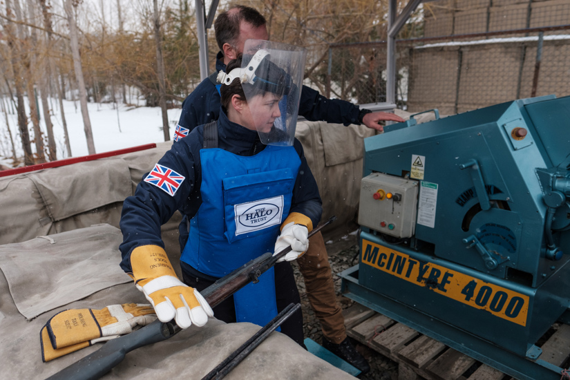 Ruth Davidson, former leader of the Scottish Conservative Party, wears PPE and a visor while receiving a demonstration from a HALO staff member