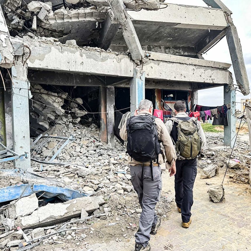 HALO staff surveying a bomb damaged school for unexploded ordnance