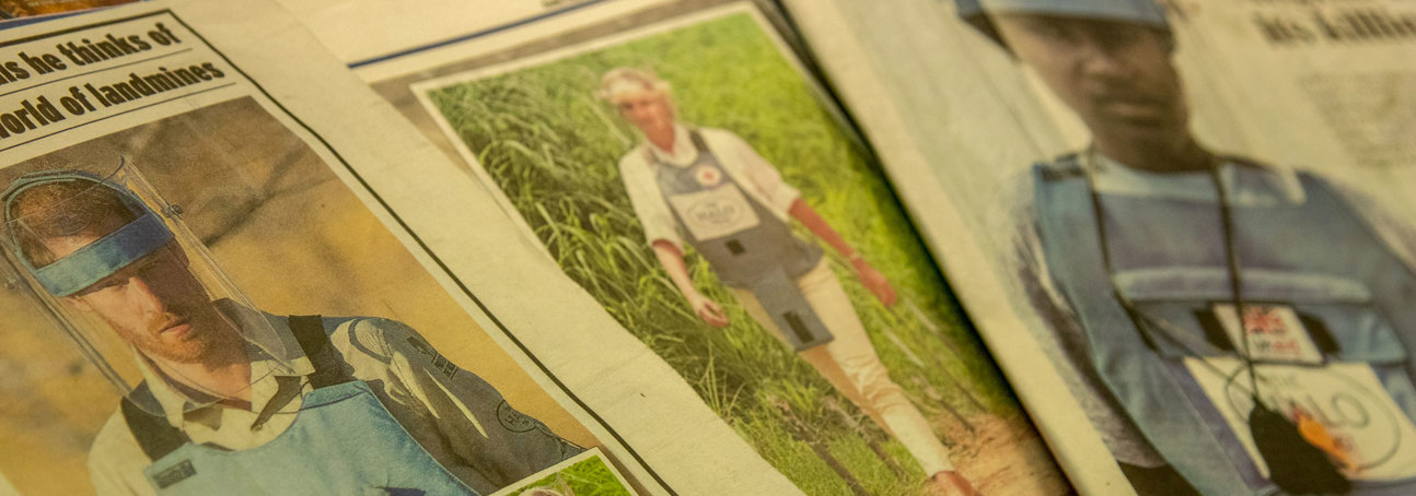 News articles of Prince Harry and Diana in Angola wearing PPE