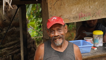 Timothy Rekoel, a father of six stands in his backyard and smiles at the camera