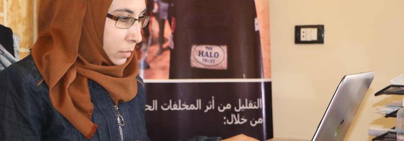 Nour Sheehan, Explosive Accident Support Worker sits in an office