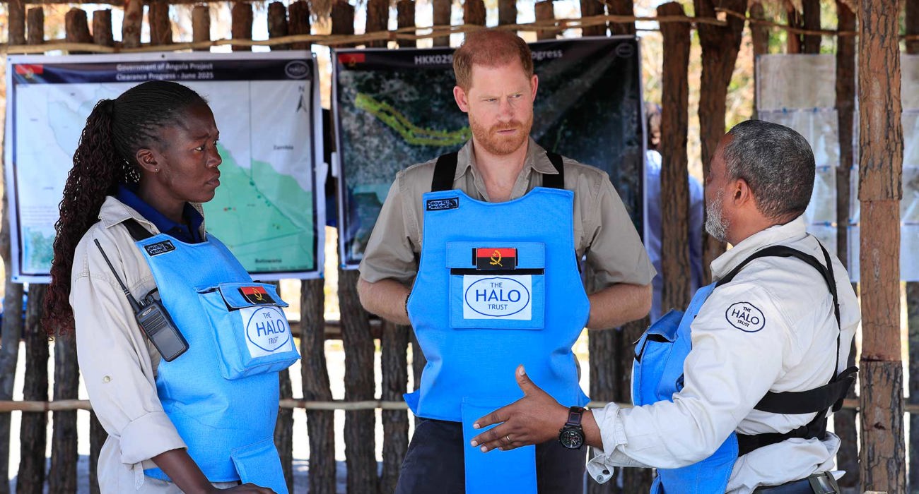 Prince Harry talking to local HALO staff