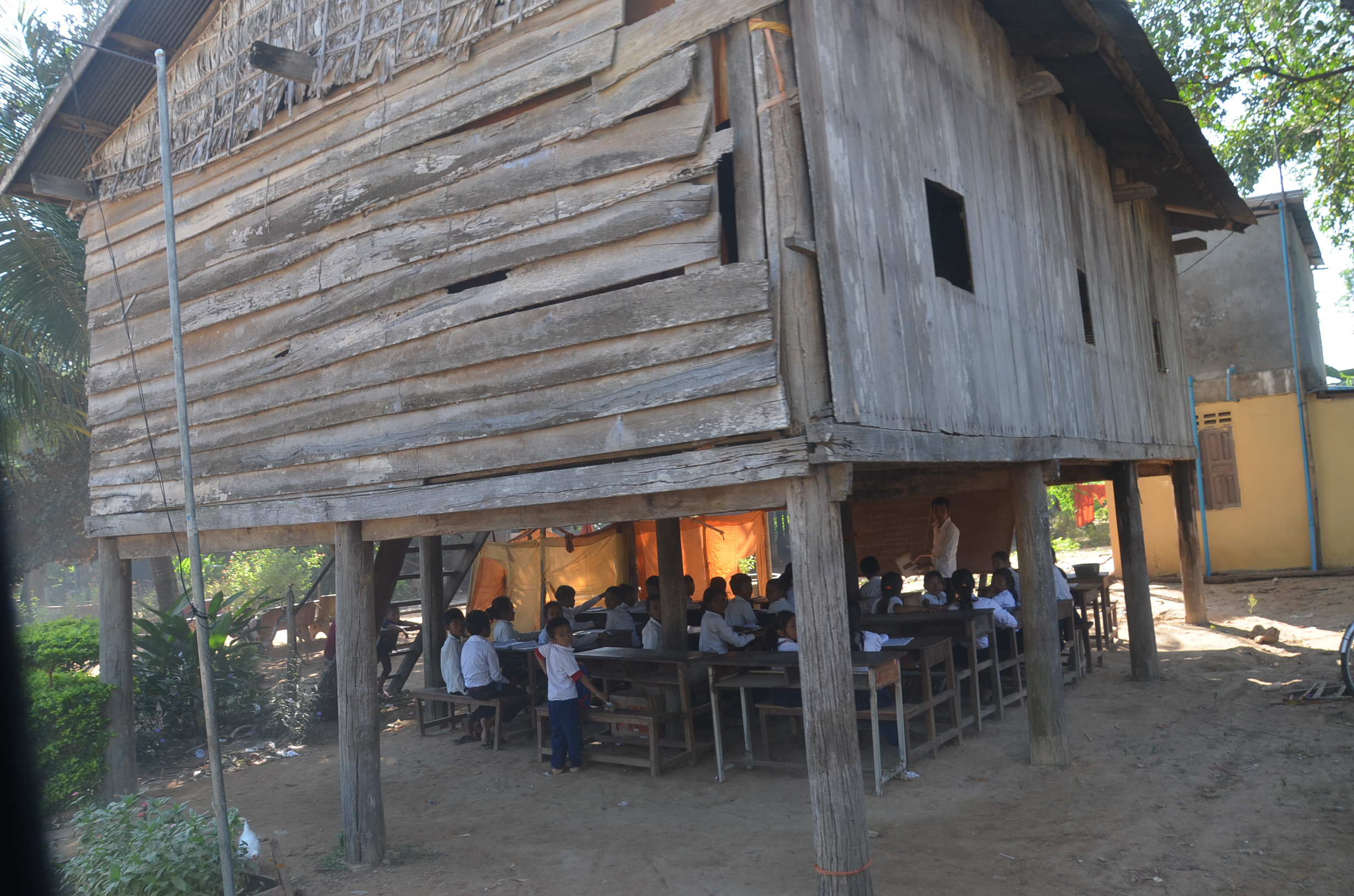 ome of the children studied outside a teacher’s house during clearance.