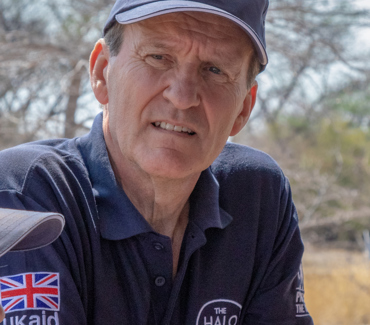 Tim Church, wearing a blue shirt and baseball cap