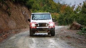 The Grenadier 4x4 is put through its paces as it drives down a Kosovo road