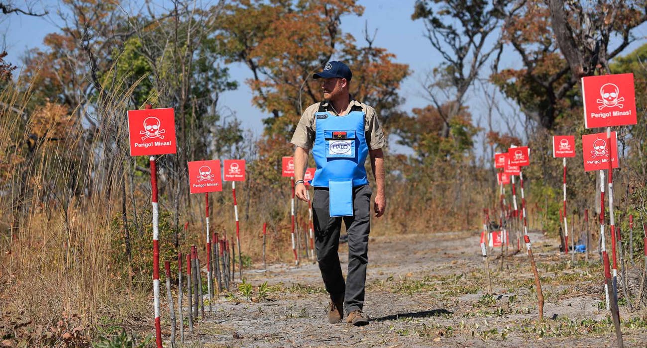 Prince Harry walking through a minefield in Angola