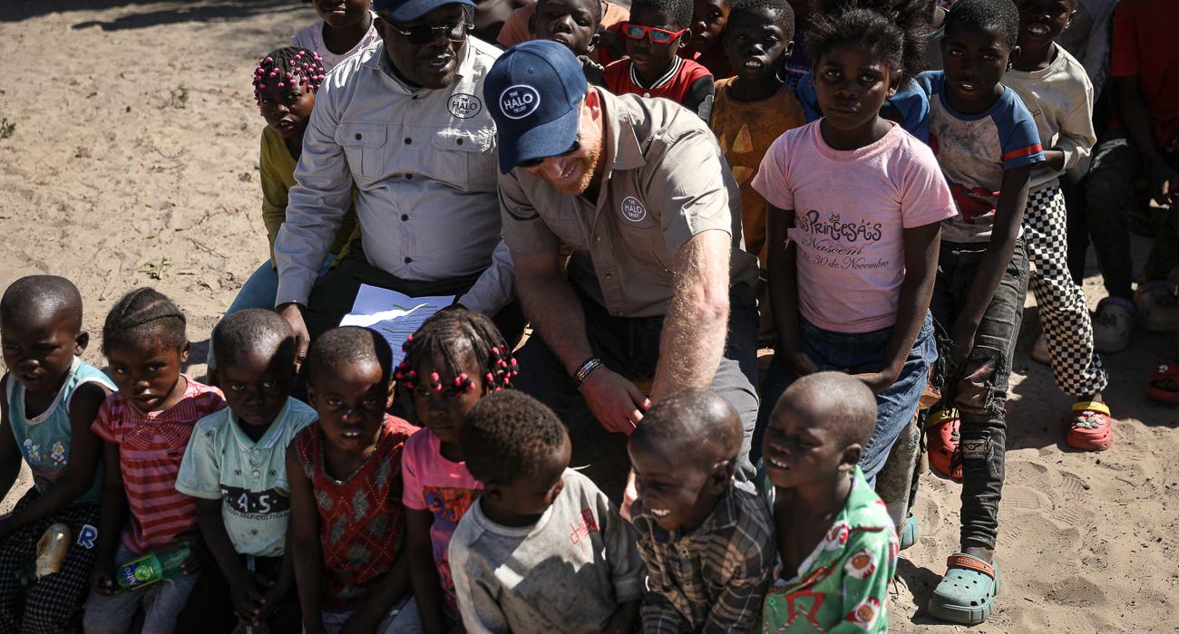 Prince Harry with a group of children in Angola